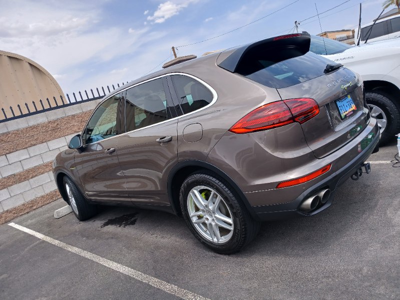 Rear view of a clean brown Porsche Cayenne after detailing